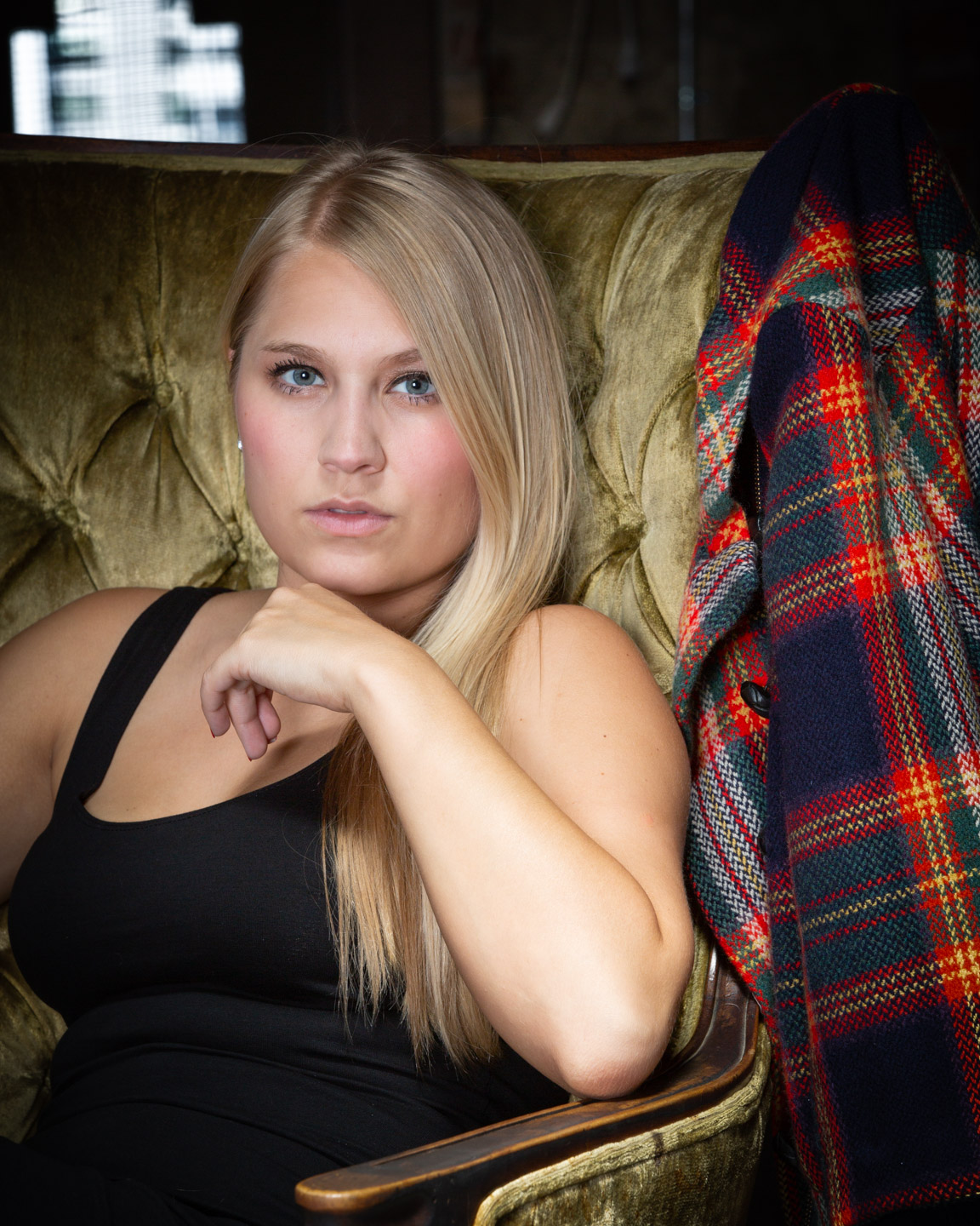 Portrait in a velvet chair, poised